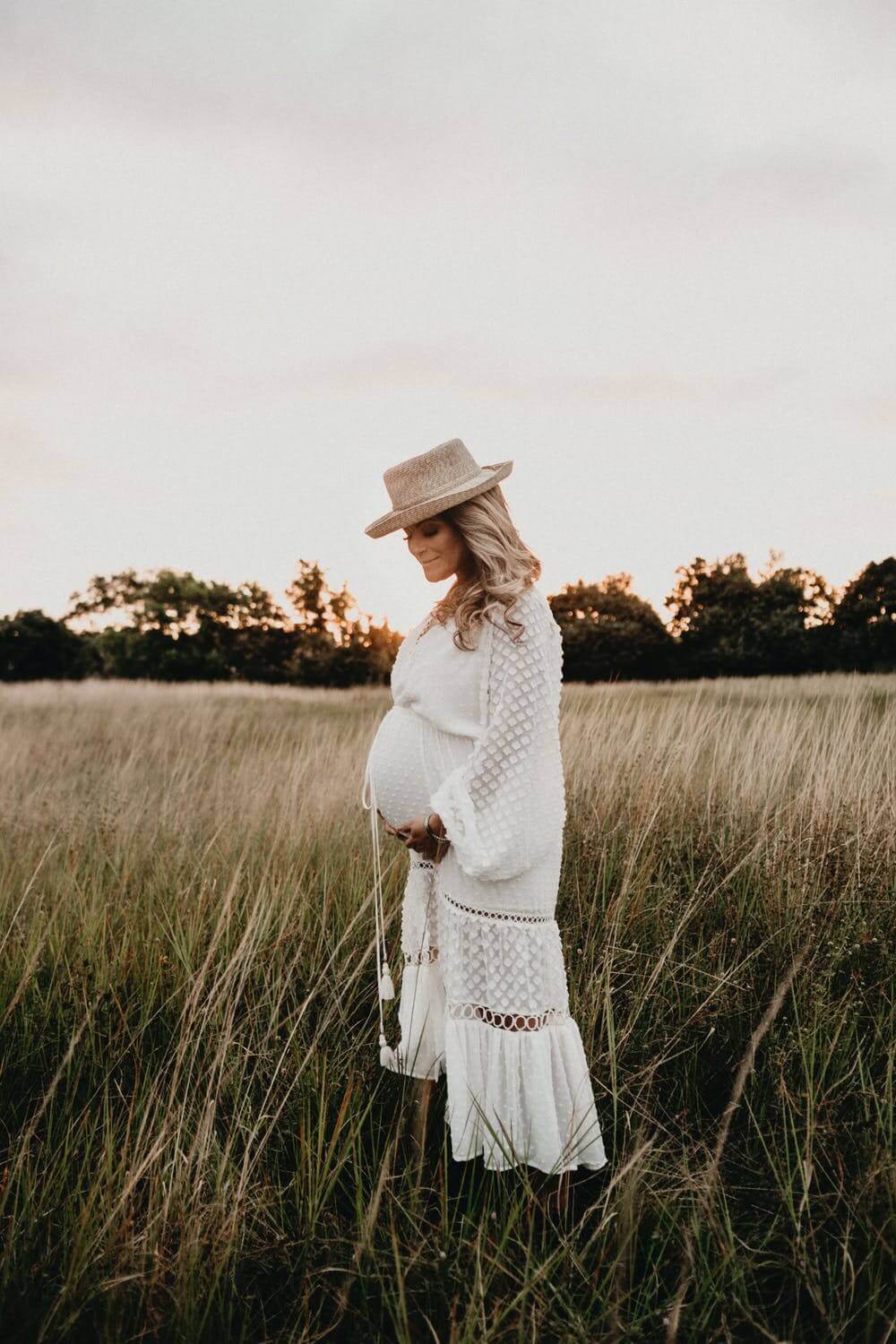 a person in a white dress in a field