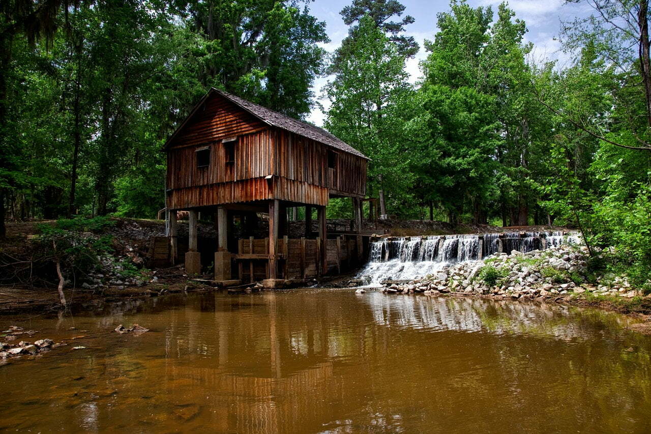 a wooden house on a lake