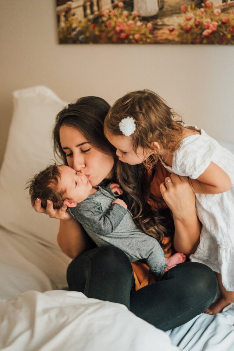 a man holding a woman and kissing her face