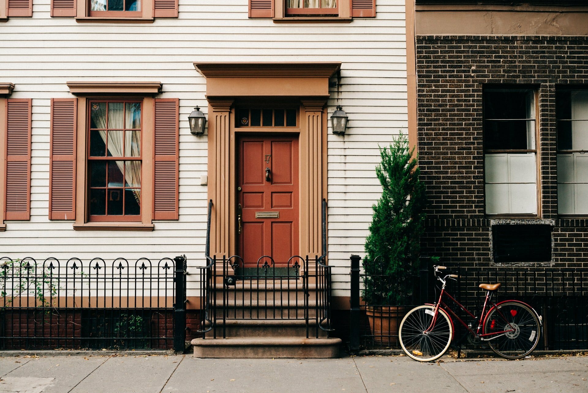 a bicycle parked in front of a house