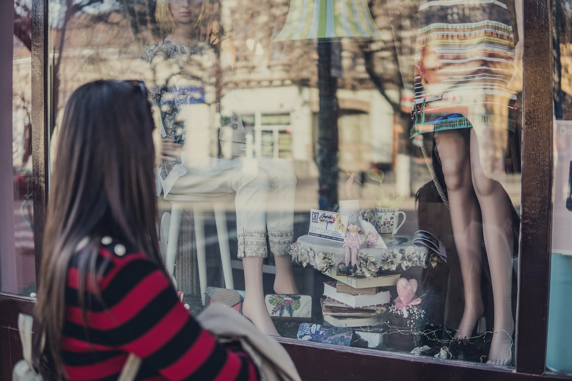 a woman looking out a window