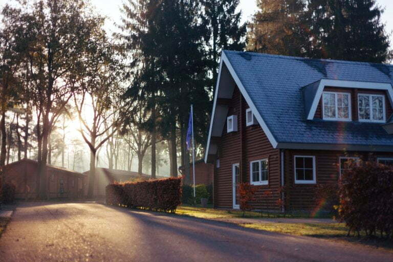 a house with a road and trees