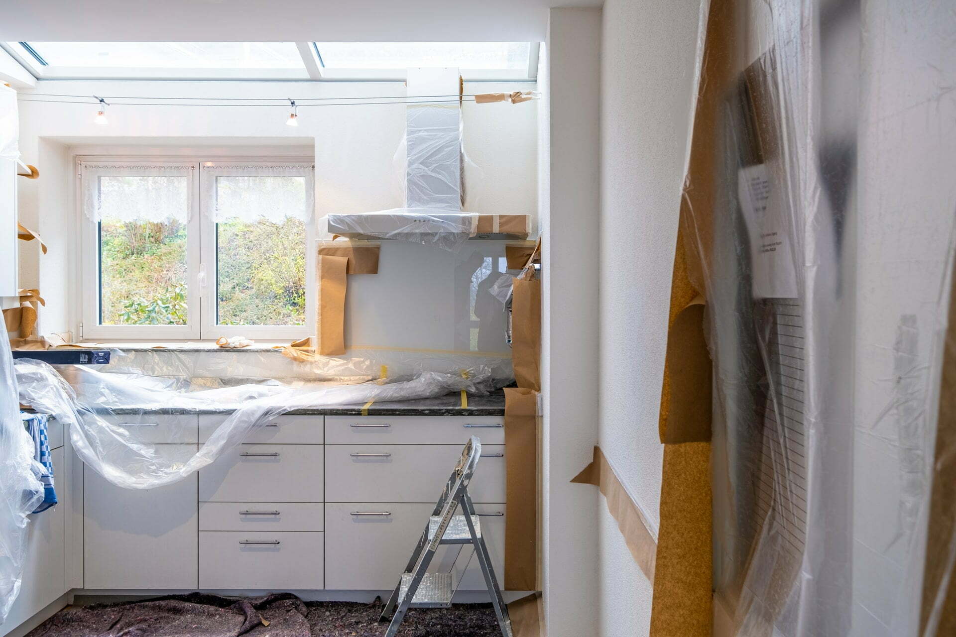 a kitchen with white cabinets