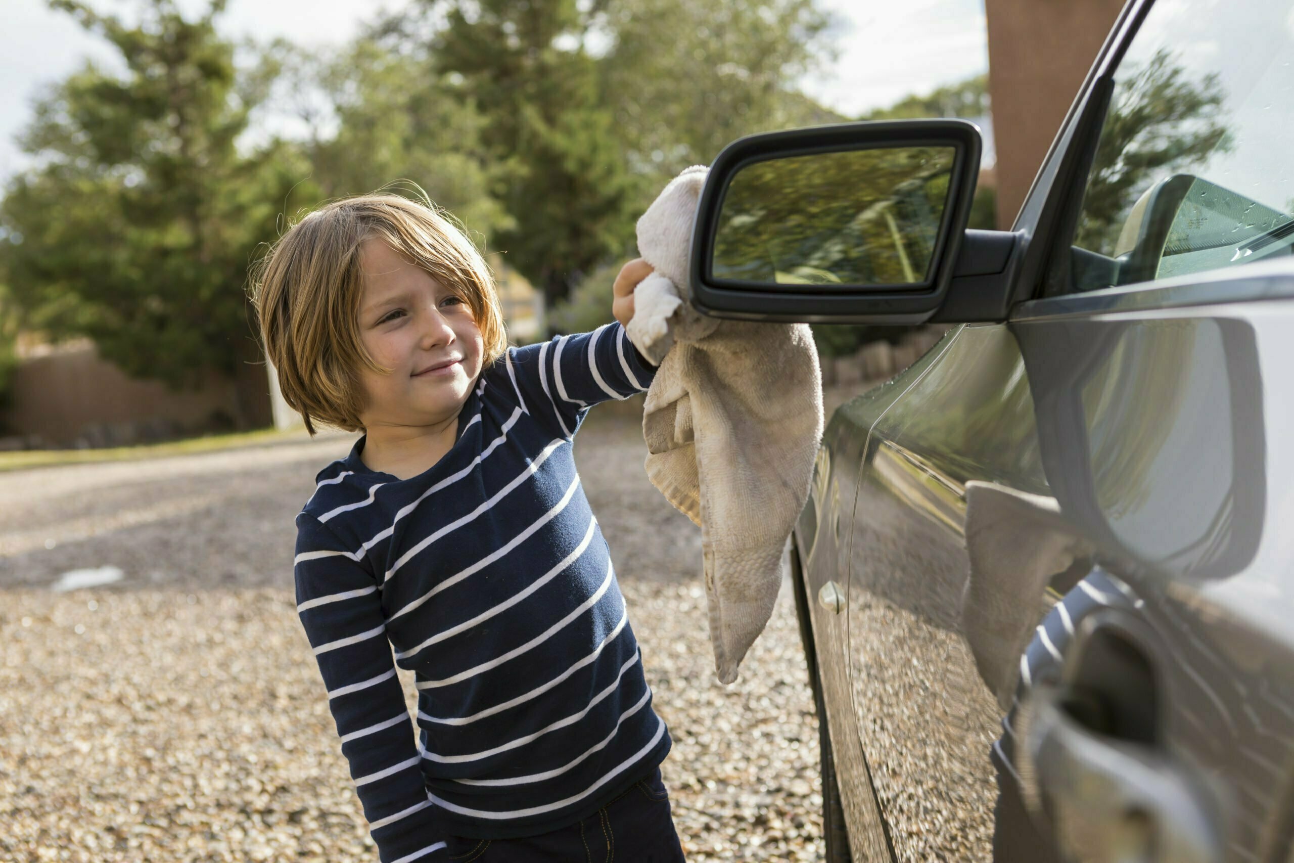 a person leaning on a car