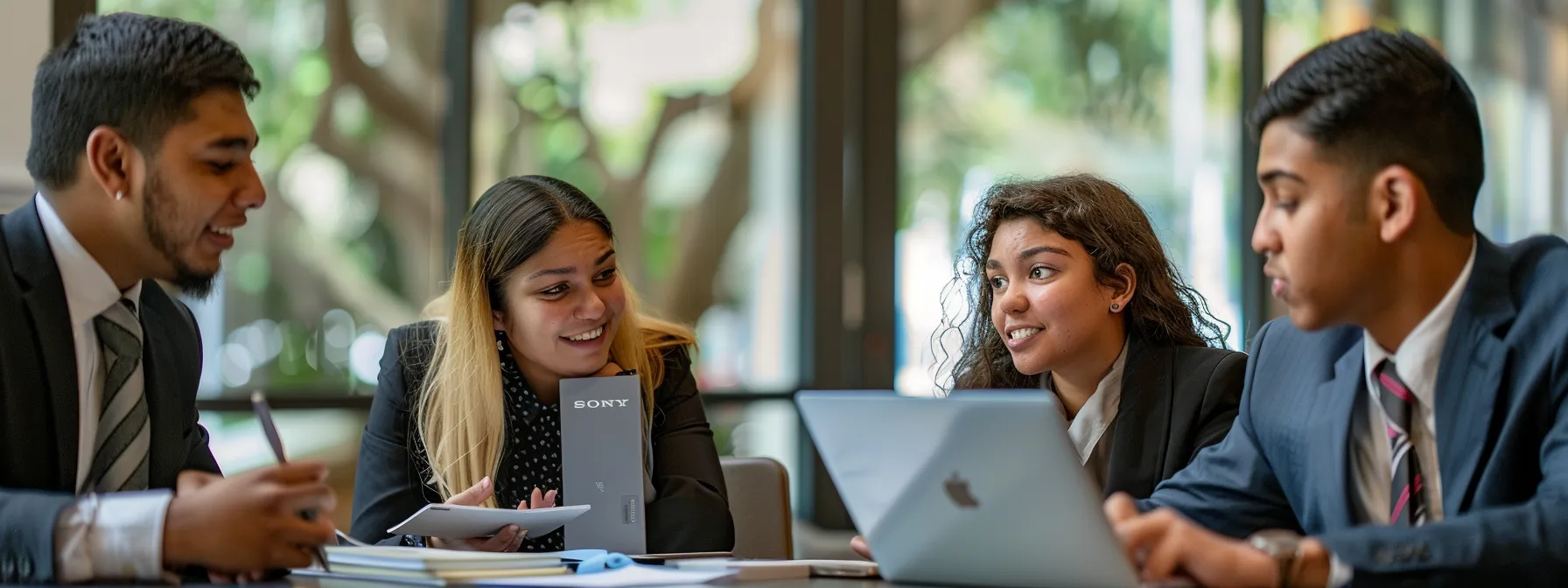a group of business professionals strategizing and discussing benefits for middle school honor society members.